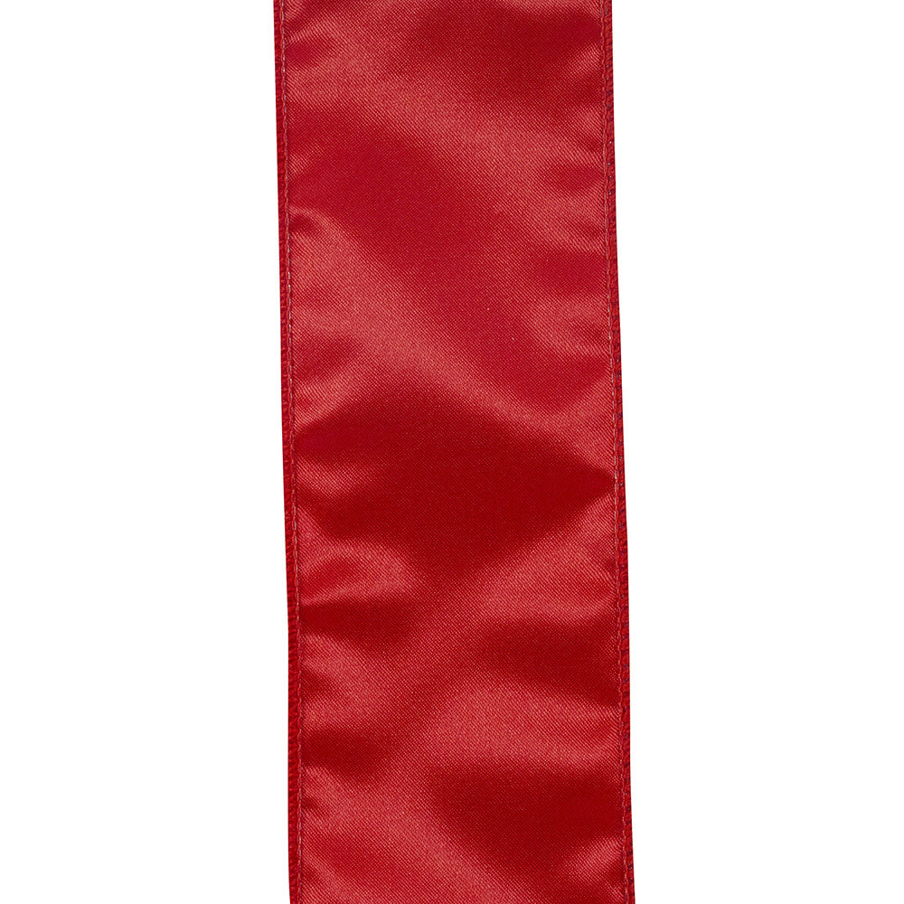 Red plush velvet ribbon roll with a smooth texture