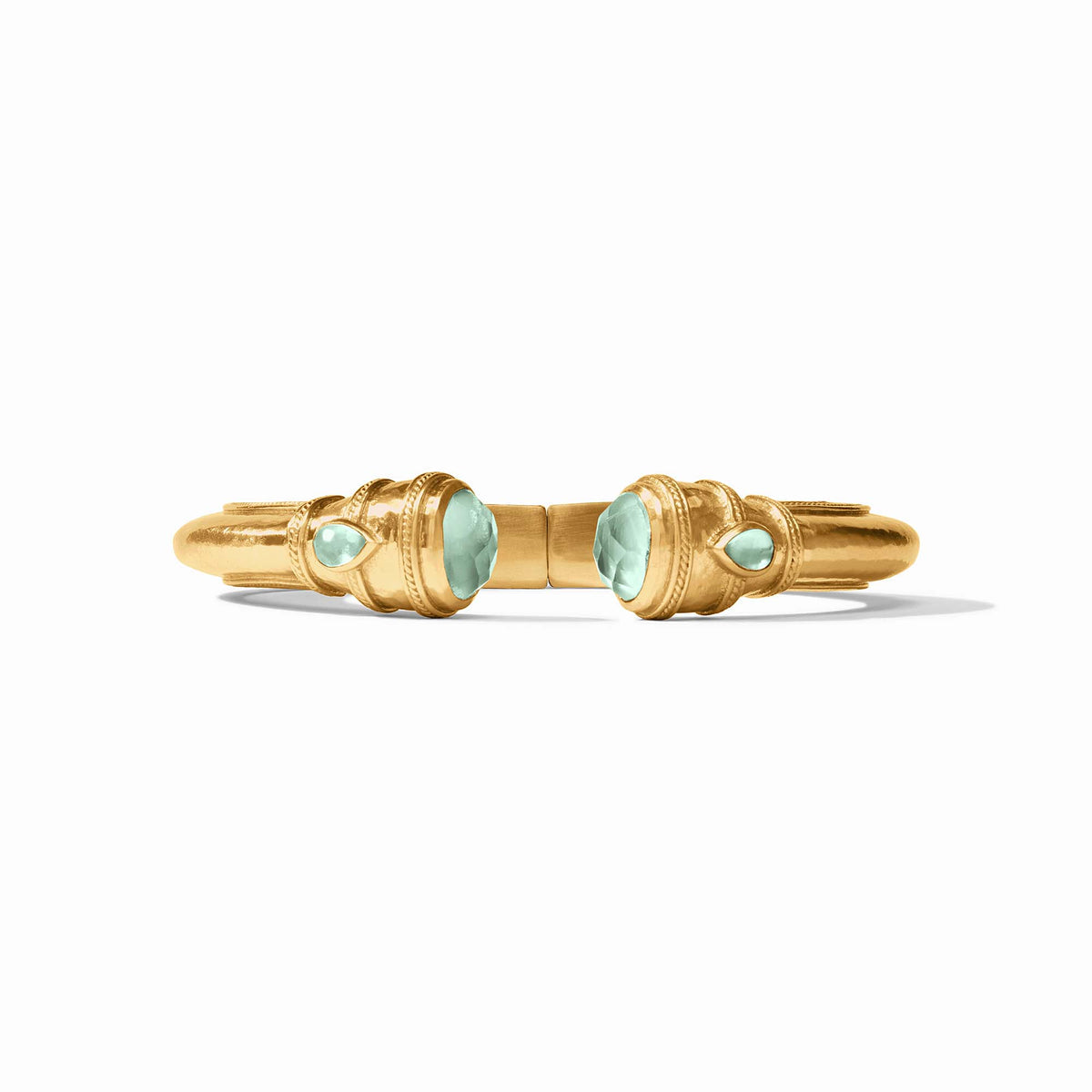 Cannes Demi Cuff in gold with shell pearl endcaps and pear-shaped gemstones.