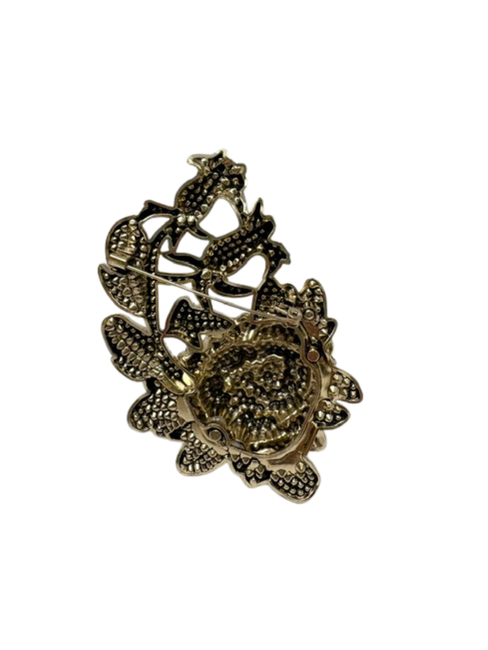 Back view of a gold-tone floral statement brooch with a pin fastening and textured metal finish.