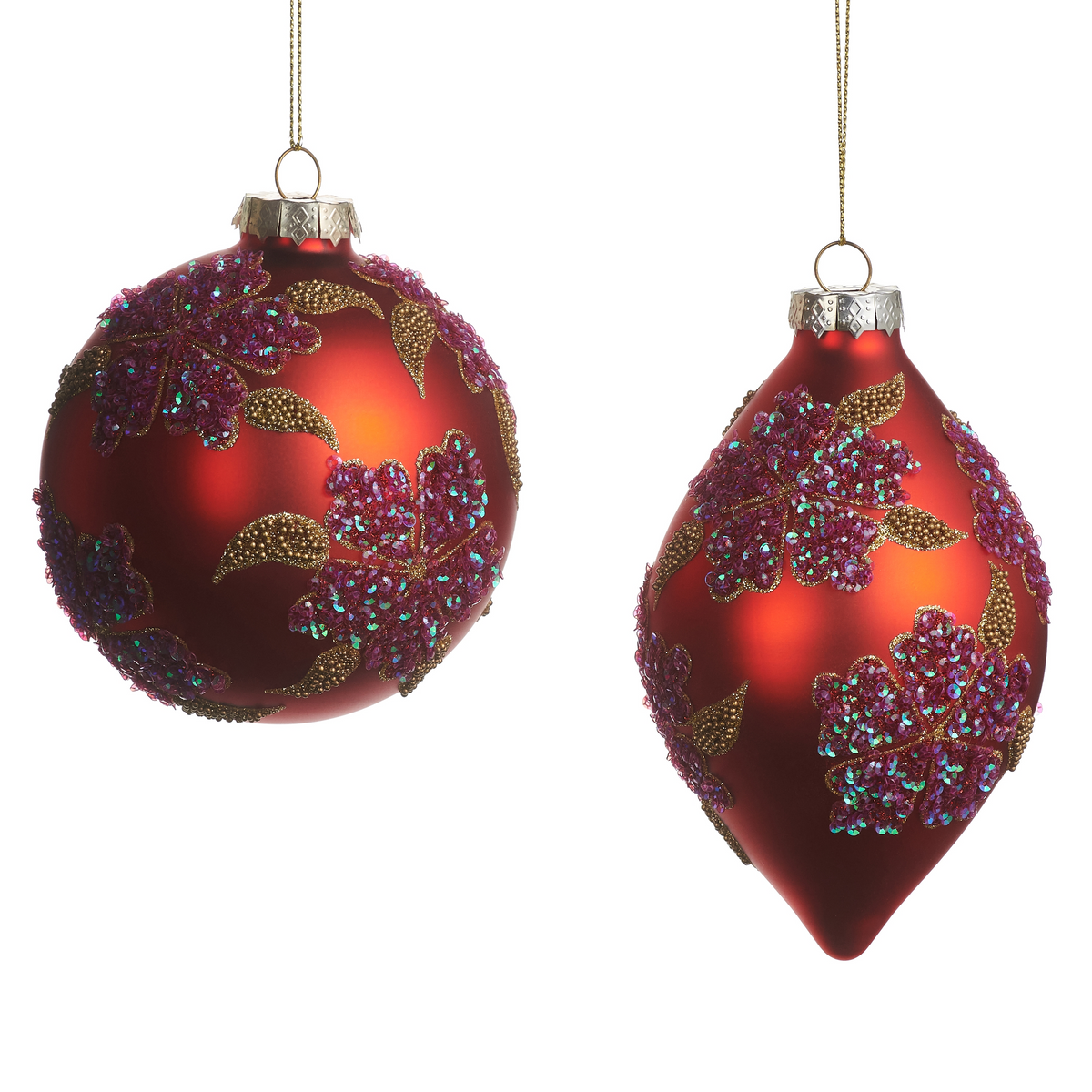 Set of two red glass ornaments with glittered purple floral designs and gold beaded accents.