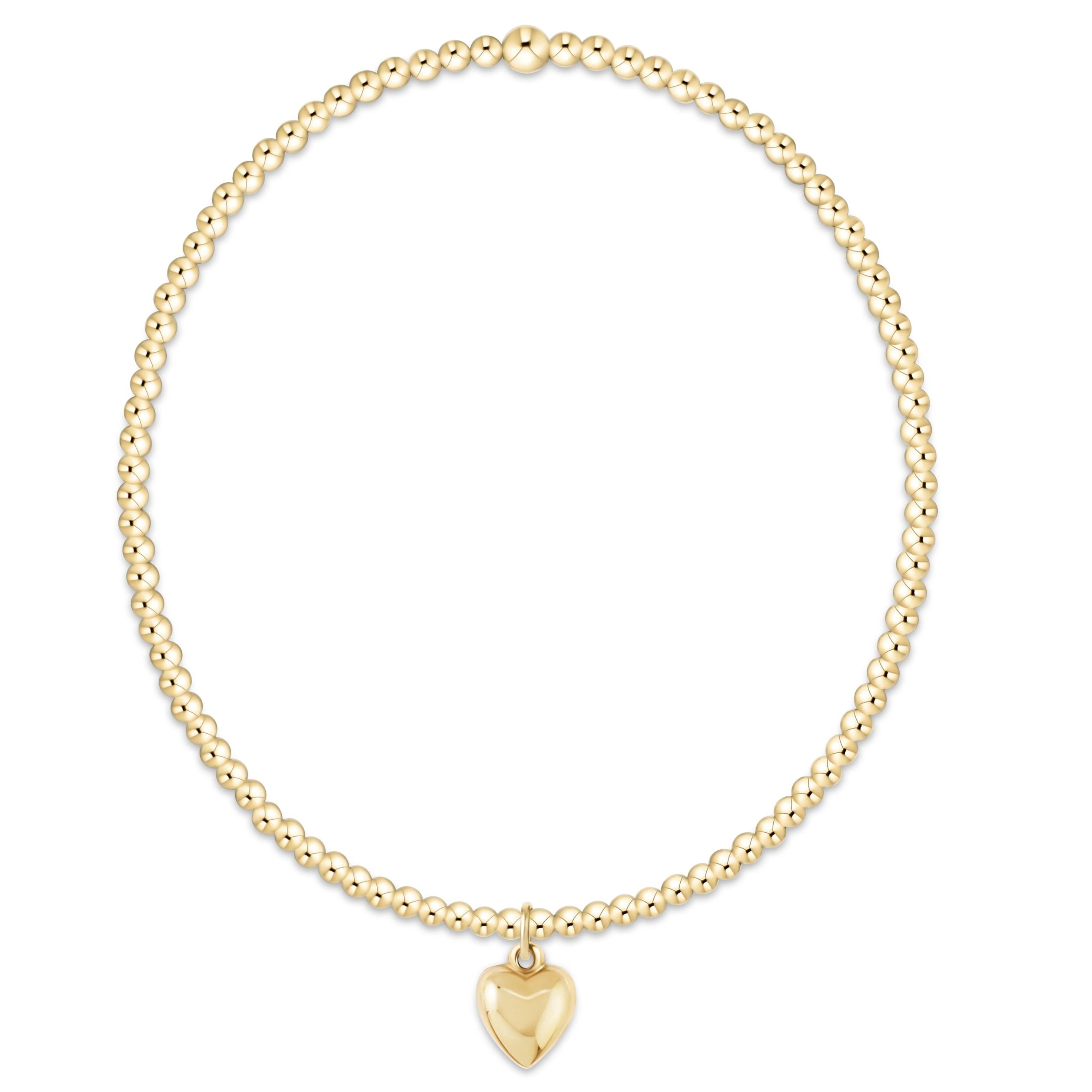 Classic Gold 2mm Bracelet with a small gold heart charm on a high-performance elastic band.