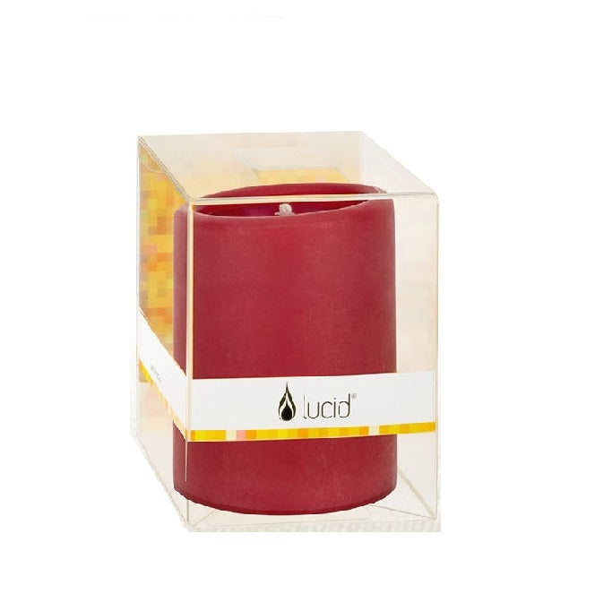 Ruby pillar candle with a smooth red wax surface in a cylindrical shape.