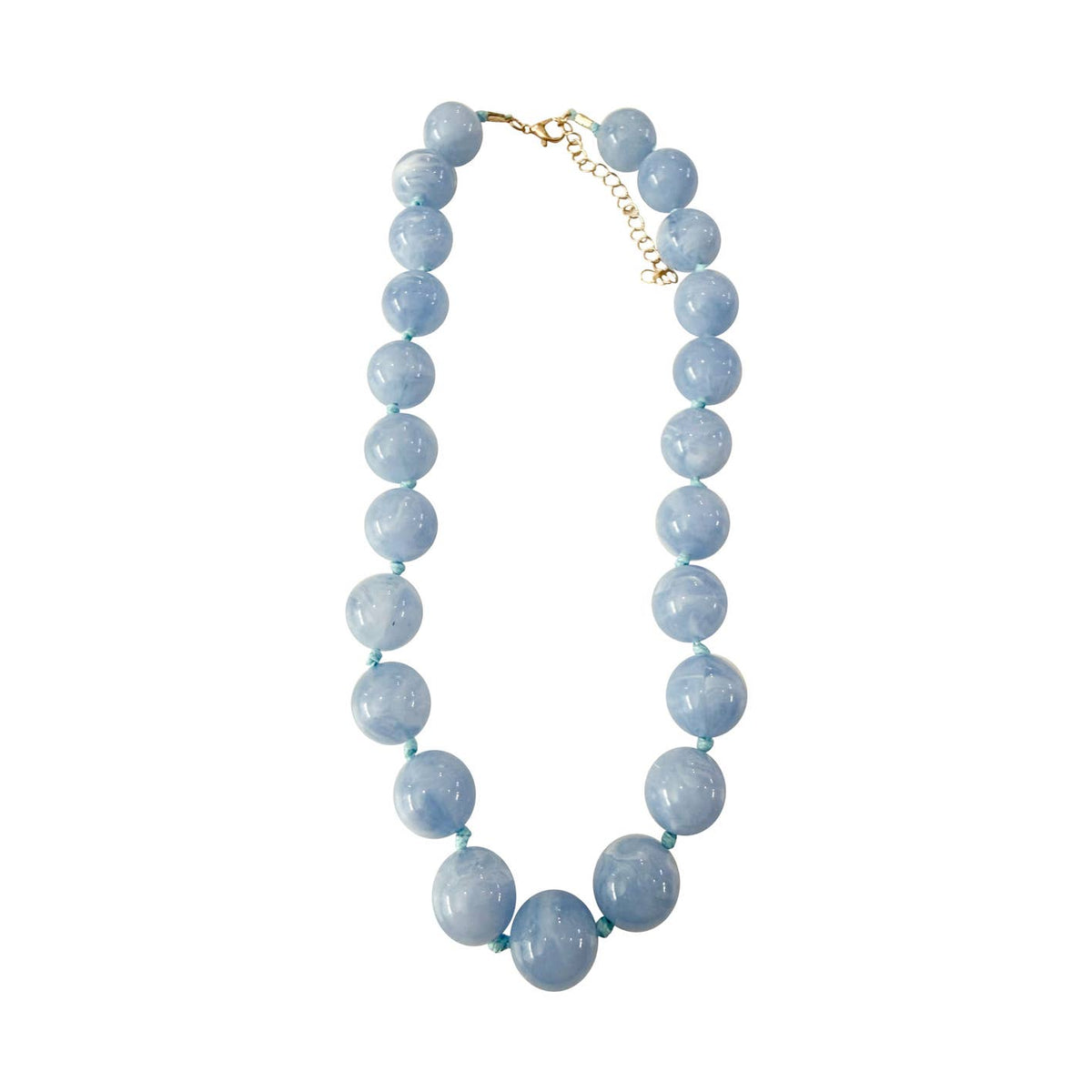 Mabry Chunky Beaded Necklace featuring large, light blue marbled stone beads and a gold clasp.