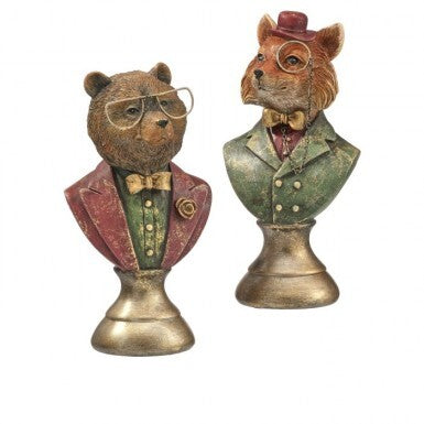 Two resin animal busts, a bear and a fox, wearing glasses, bow ties, and formal attire.