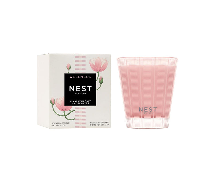 Nest Himalayan Salt & Rosewater scented candle in a pink frosted glass jar next to its box.