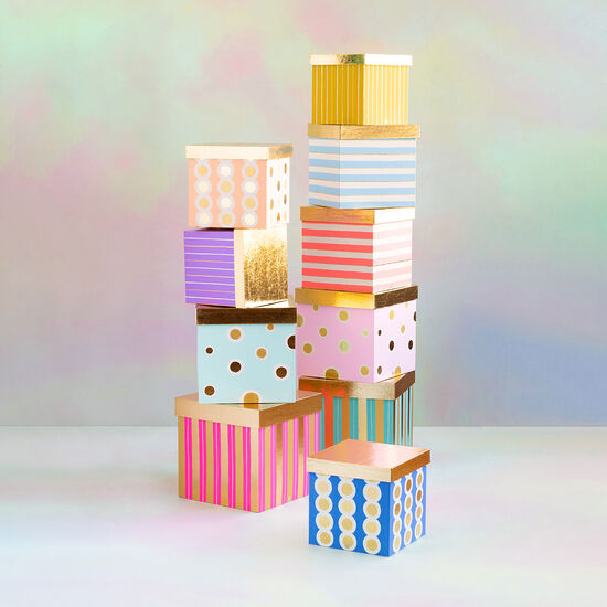 Rainbow Gilded Nesting Box featuring a multicolor rainbow pattern with gold gilded accents on the lid.