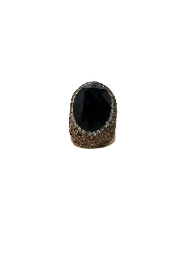 Fashion gemstone ring featuring a large oval black stone surrounded by brown and clear crystals.