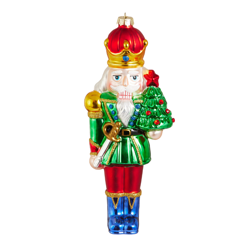 8.25-inch glass traditional nutcracker ornament wearing a green jacket and holding a Christmas tree.
