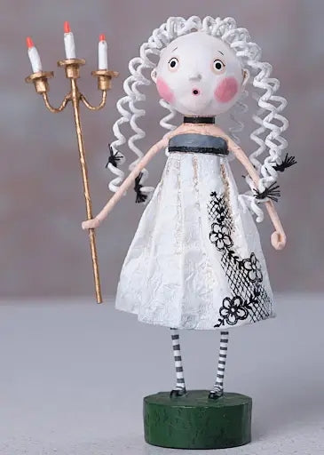 Whimsical doll holding a gold candelabra with three white candles. Doll wears a white lace dress and striped stockings.