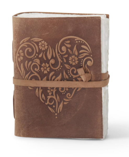 8 inch brown leather journal with an embossed floral heart design and a wrap-around tie closure.