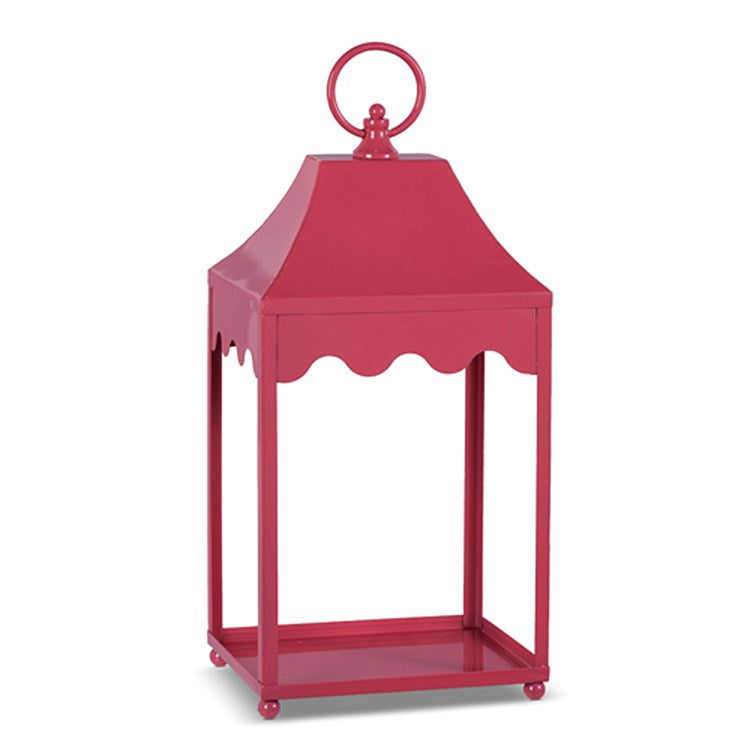 Eight-inch wide pink iron lantern with an openwork geometric frame.