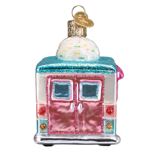 Glass ice cream truck ornament with pink doors, blue glitter roof, and a sprinkle scoop on top.