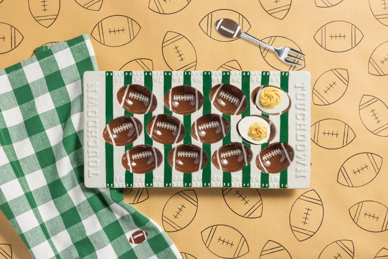 Football Field Deviled Egg Tray Set with a ceramic platter, matching fork, and green checkered towel