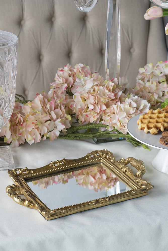 Small rectangular mirror tray with handles in a neutral finish