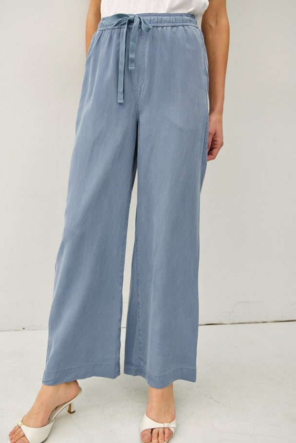 Women's Jane Tencel wide leg pants in neutral tone with elastic waistband and side pockets.