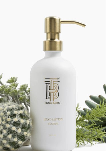 Glass hand lotion dispenser with gold pump in blonde color