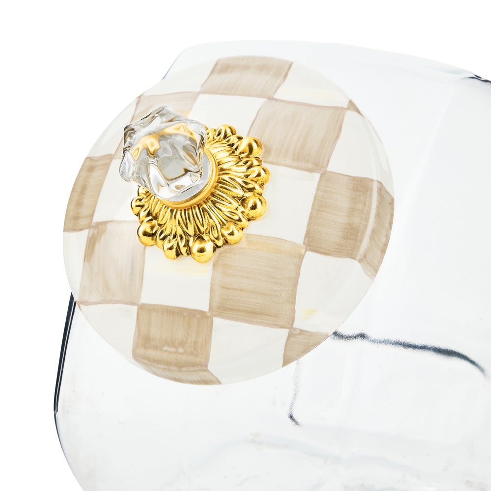 Glass cookie jar with hand-glazed steel lid featuring a mocha check pattern.