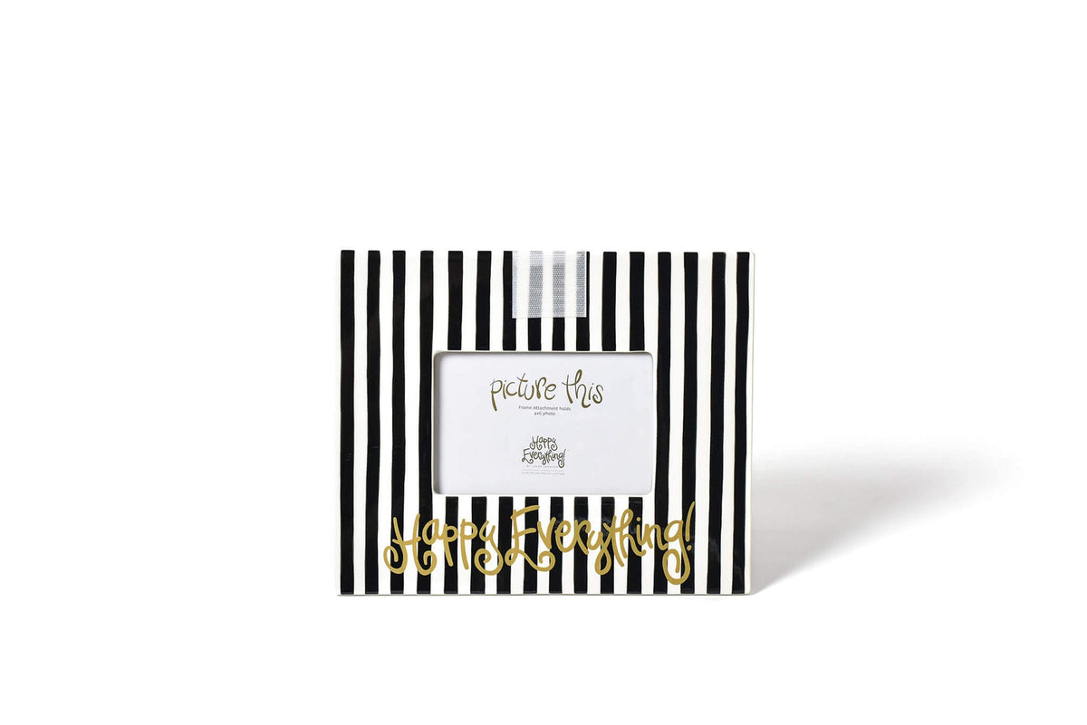 Ceramic black frame with white stripe pattern holding a photo