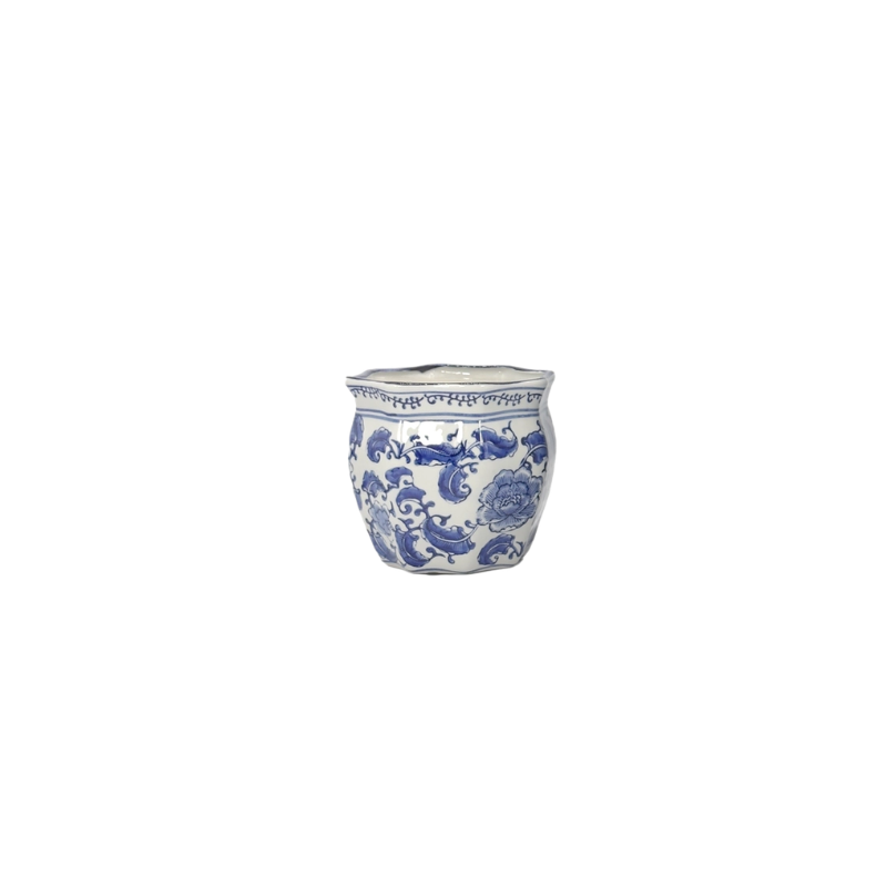 White ceramic chinoiserie planter pot with blue floral patterns and a fluted rim.