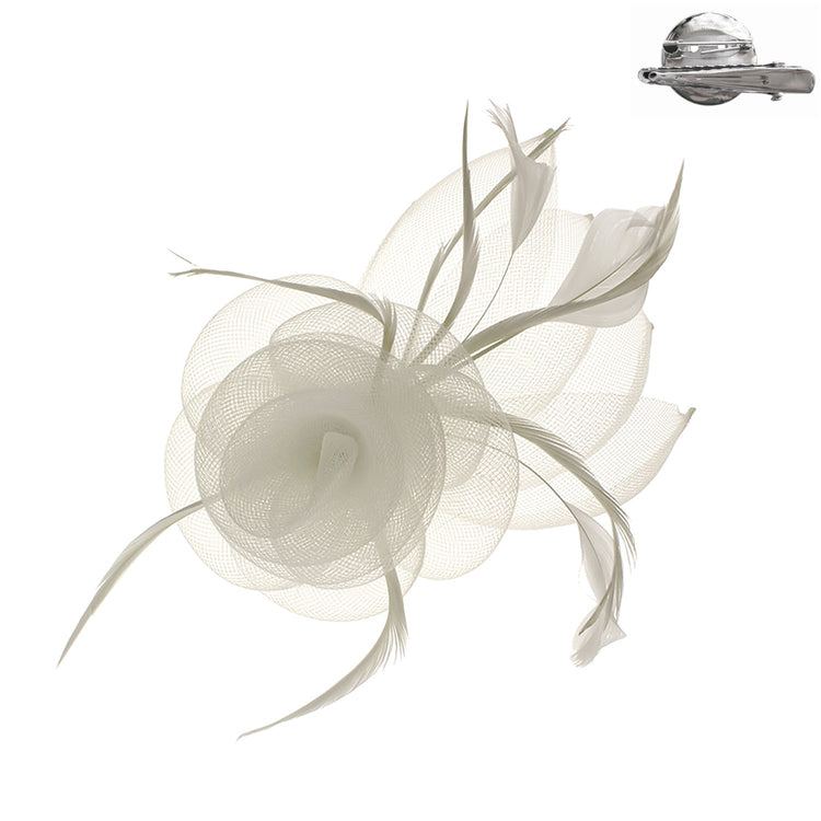 Black mesh fascinator with white floral print featuring a decorative clip attachment.