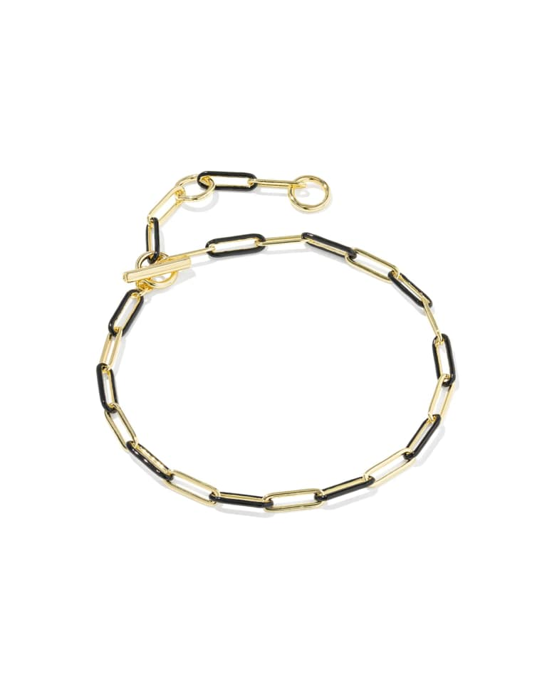 Courtney gold chain link bracelet with black enamel accents and a toggle closure.