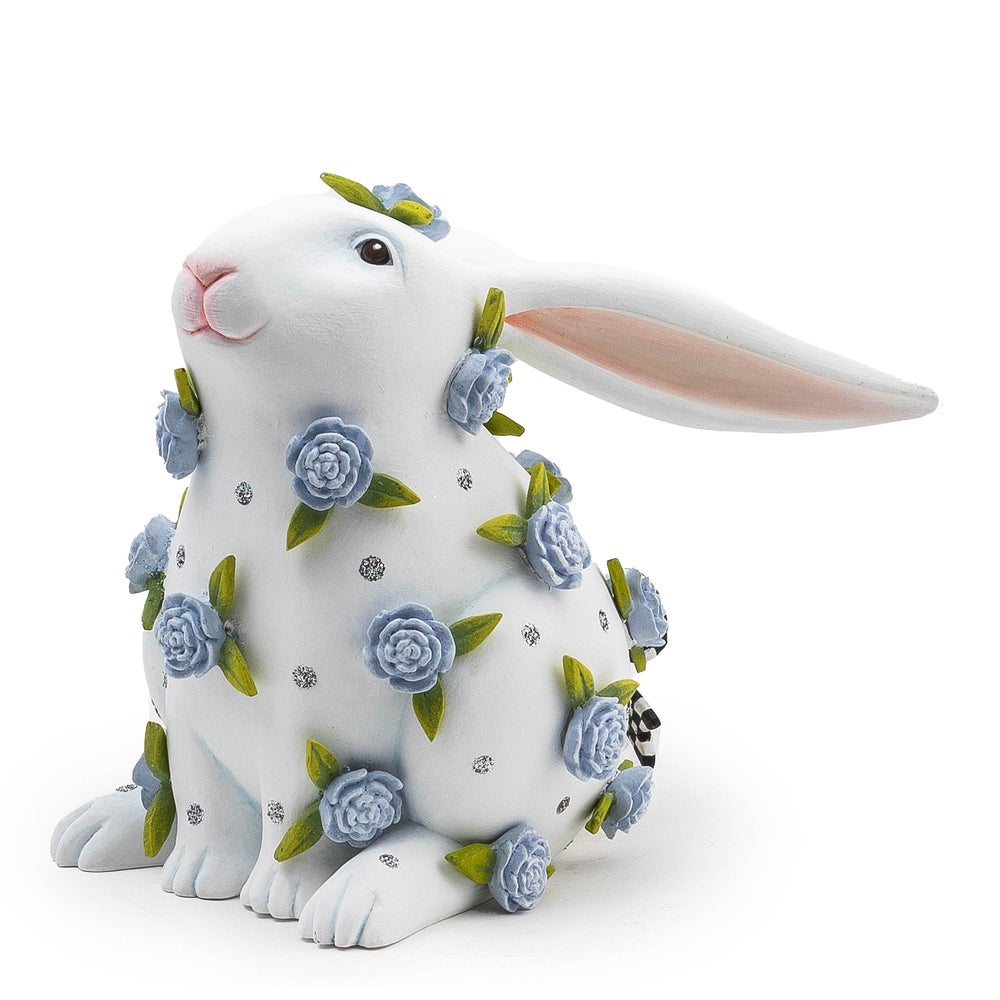 Resin sitting rabbit figurine in periwinkle peony color with floral pattern and natural handmade silhouette.