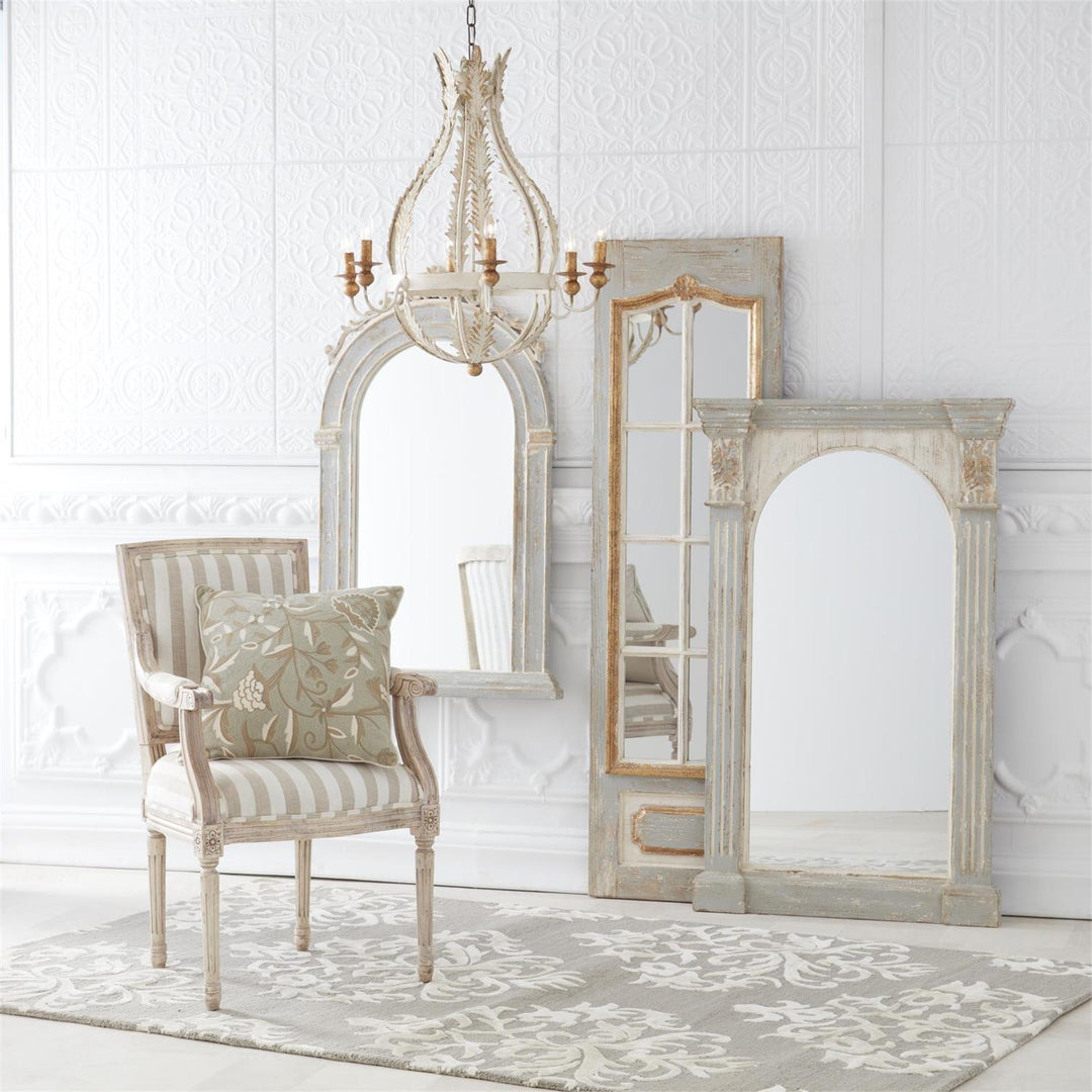 Weathered fir column framed arch mirror with a large reflective surface.