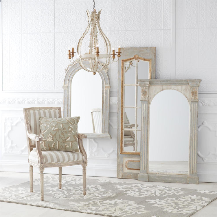 Weathered fir column framed arch mirror with a large reflective surface.