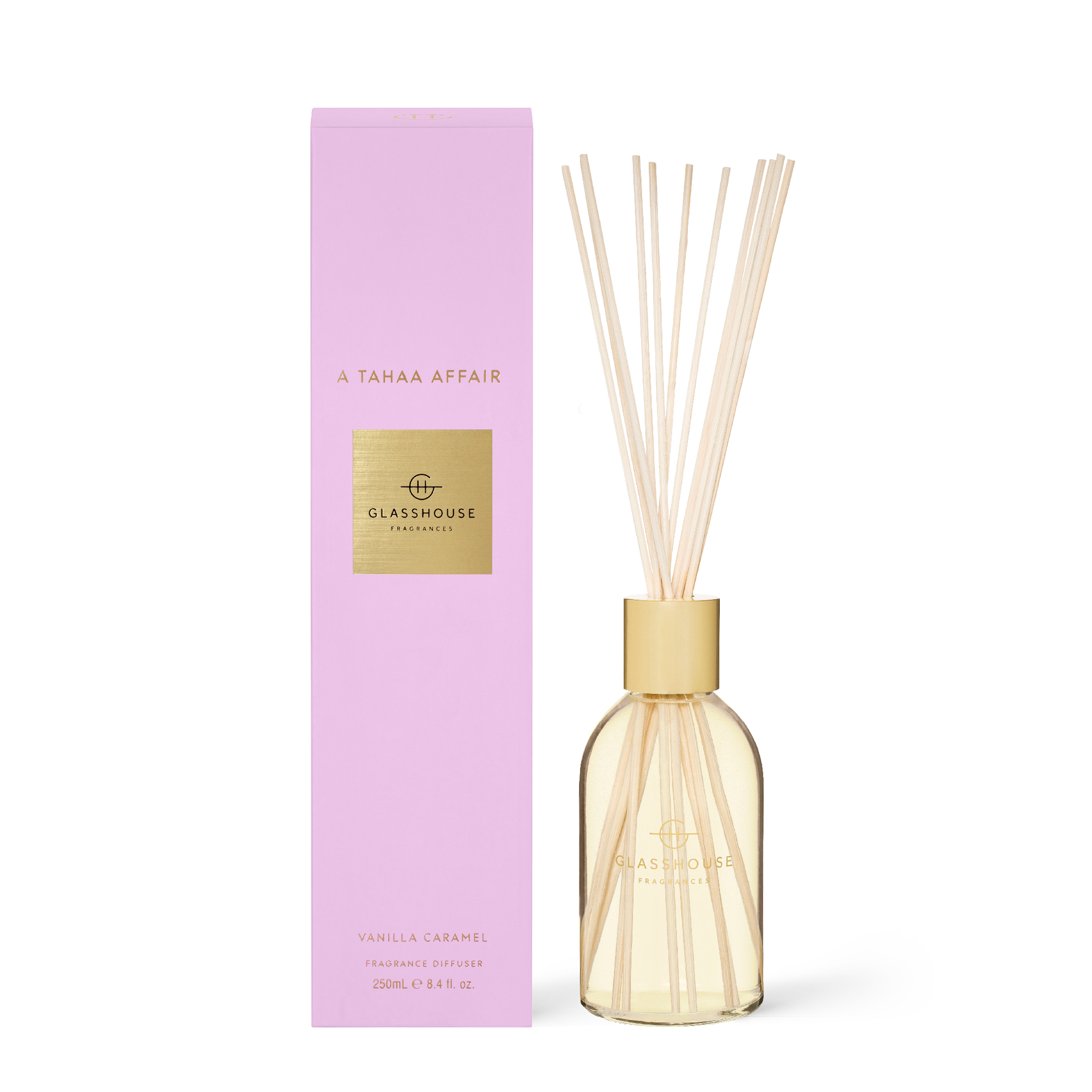 Glass Tahaa Affair diffuser with caramel-colored liquid, coconut-scented reeds, and a white lid.