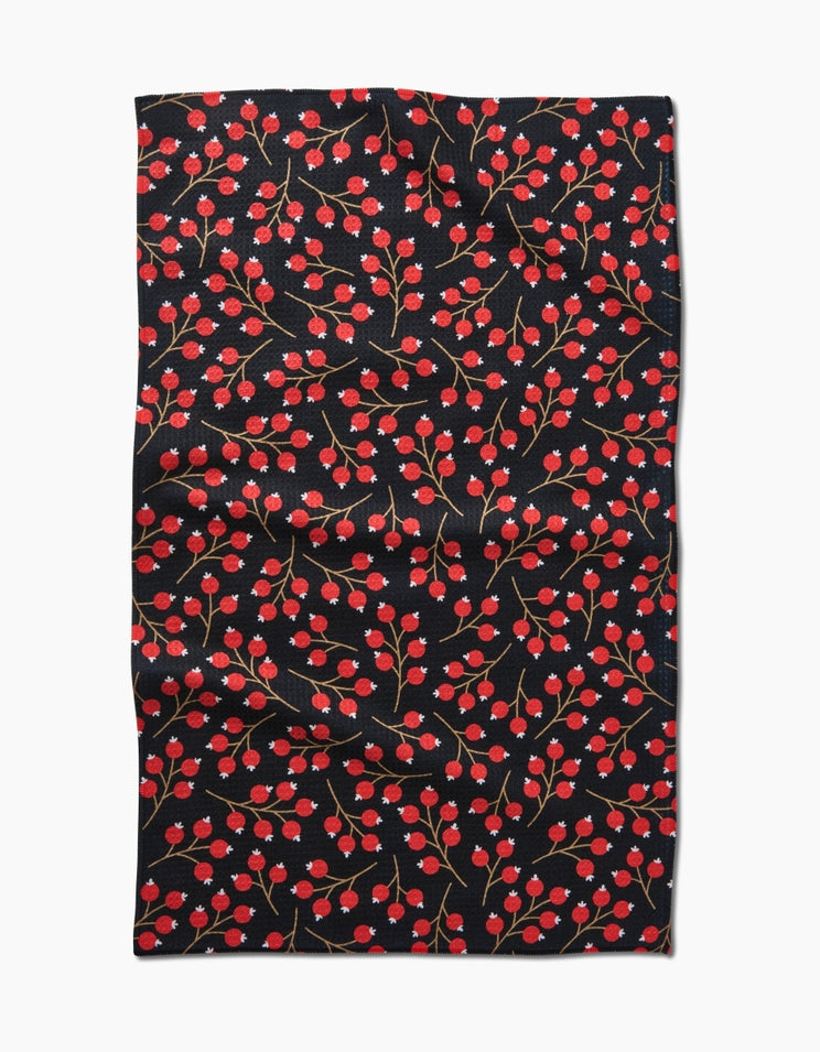 Holiday tea towel with waffle weave construction in red featuring a festive snowman pattern.