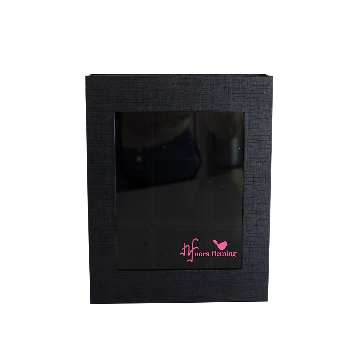 Acrylic keepsake box with magnetic closure holding small figurines