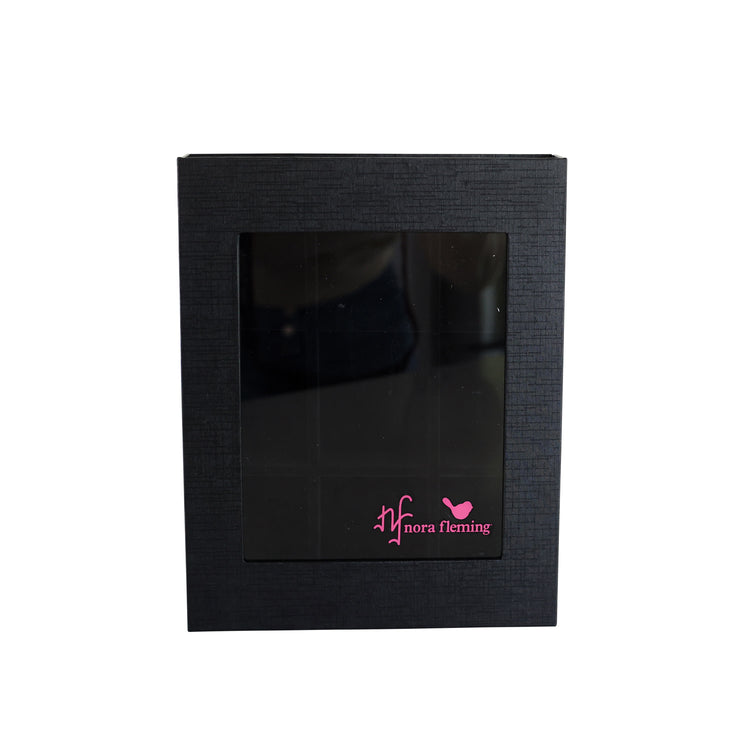 Acrylic keepsake box with magnetic closure holding small figurines
