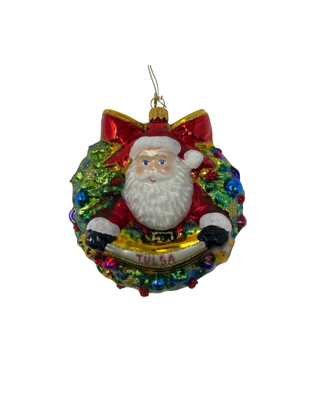 Hand-painted glass Santa ornament inside a glittery green wreath with a red bow and Tulsa banner.