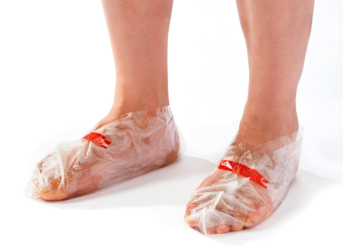 Men's Foot Peel Duo kit with two adhesive foot masks featuring white straps.