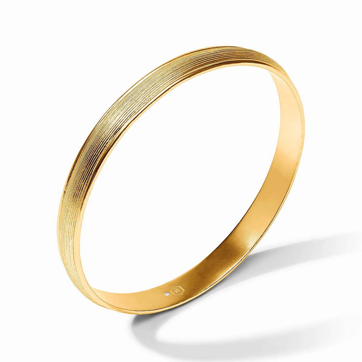 Gold-plated Cobblestone Stacking Bangle with a textured linear pattern and Julie Vos hallmark.