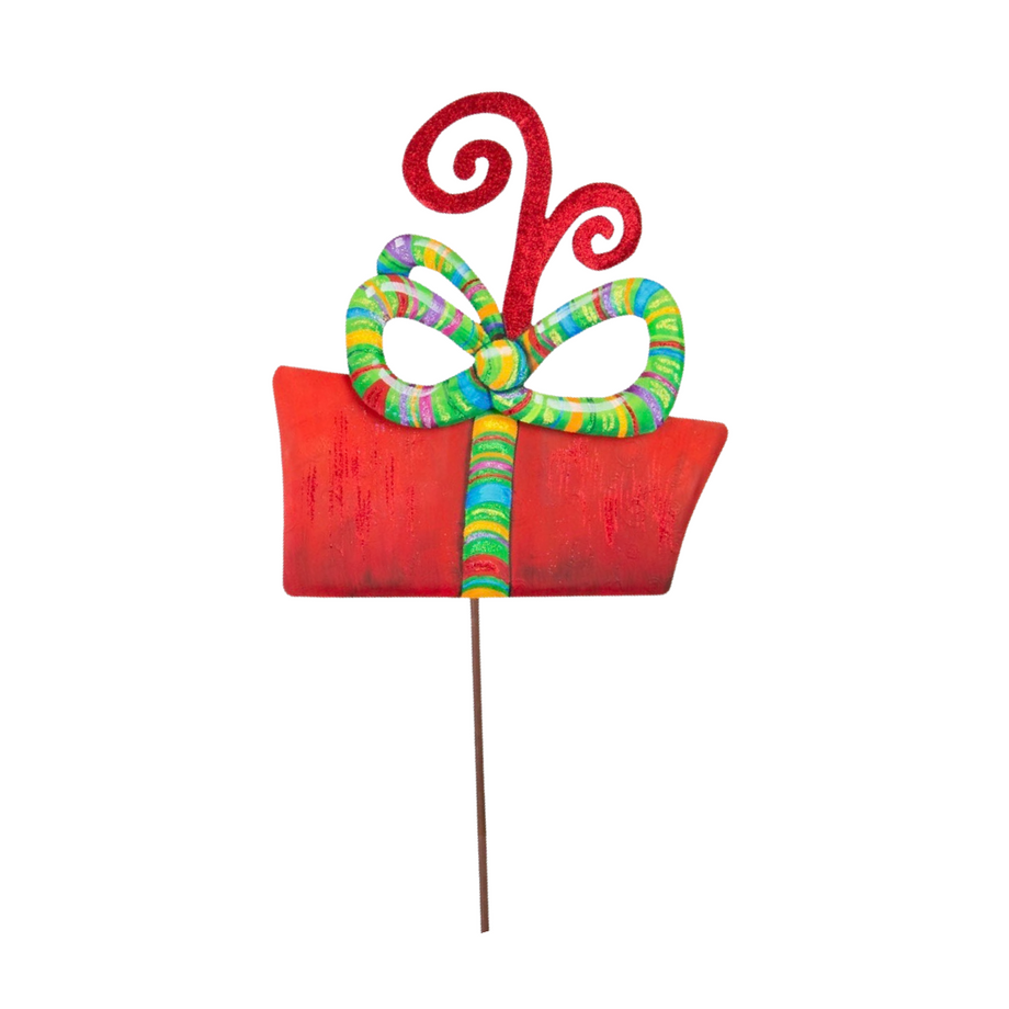 Red gift box yard stake with a colorful striped bow and glittery red swirls on top.