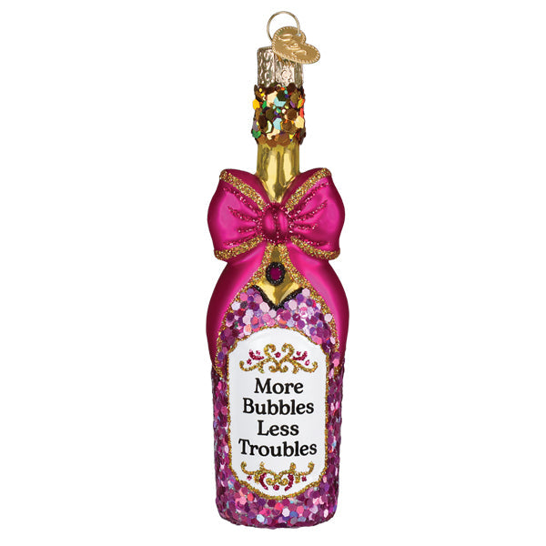 Champagne bottle with a glittering bow ornament tied around the neck.