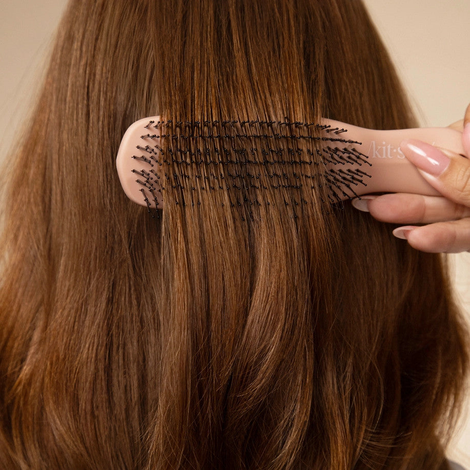 Terracotta Scalp Renewal Brush with multi-level bristles and ergonomic handle