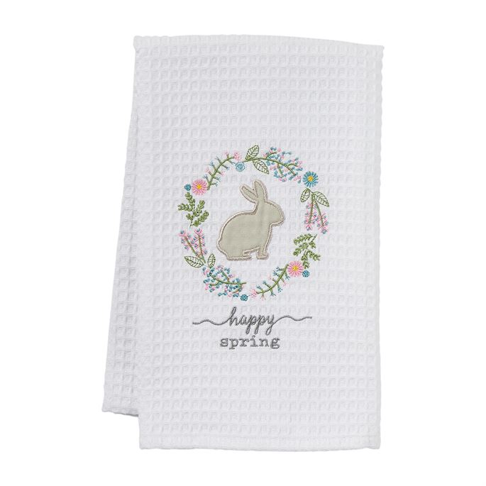 White waffle weave towel with embroidered bunny in floral wreath and "happy spring" text.