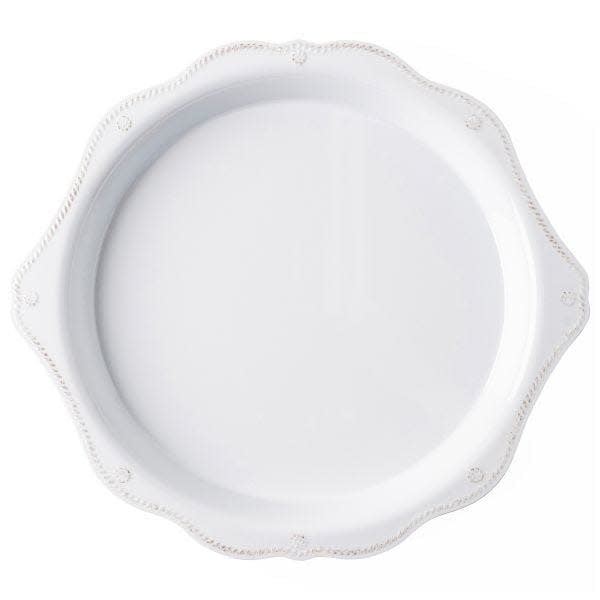 Round melamine serving platter with scalloped edge in berry color