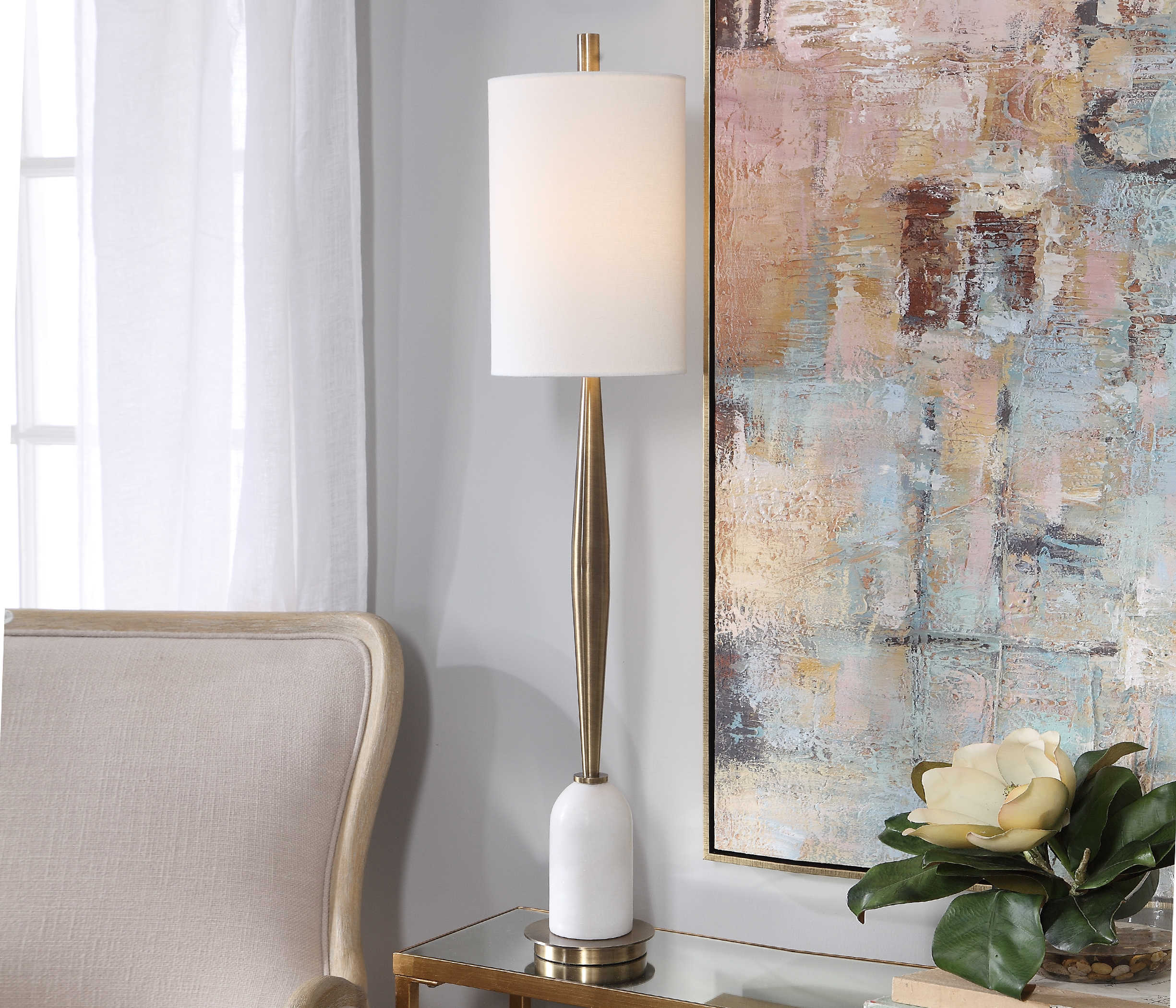 Minette Buffet Lamp with a white cylindrical shade on a slender metallic stand.