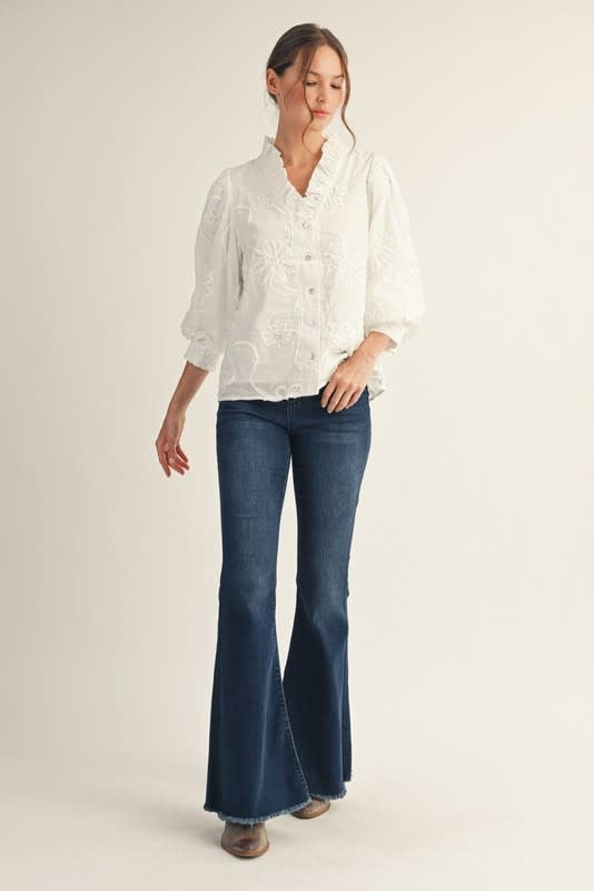 Madeline button-down top in white cotton with raised 3D floral pattern.