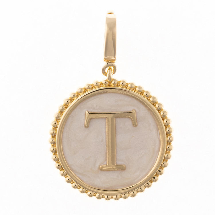 Circular .5-inch charm in 18k gold plating with faux mother-of-pearl inlay and clasp.