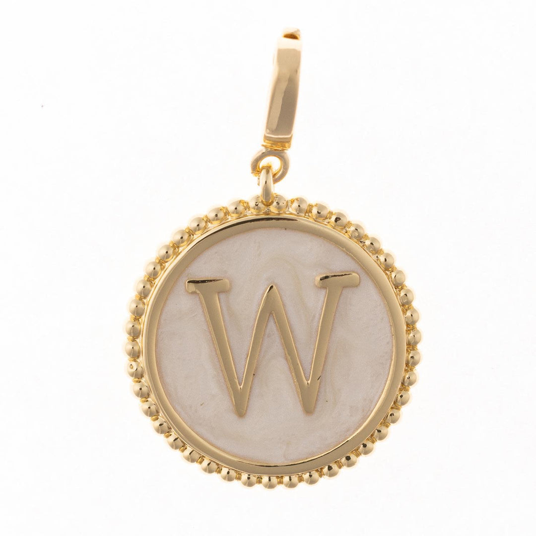 Circular .5-inch charm in 18k gold plating with faux mother-of-pearl inlay and clasp.
