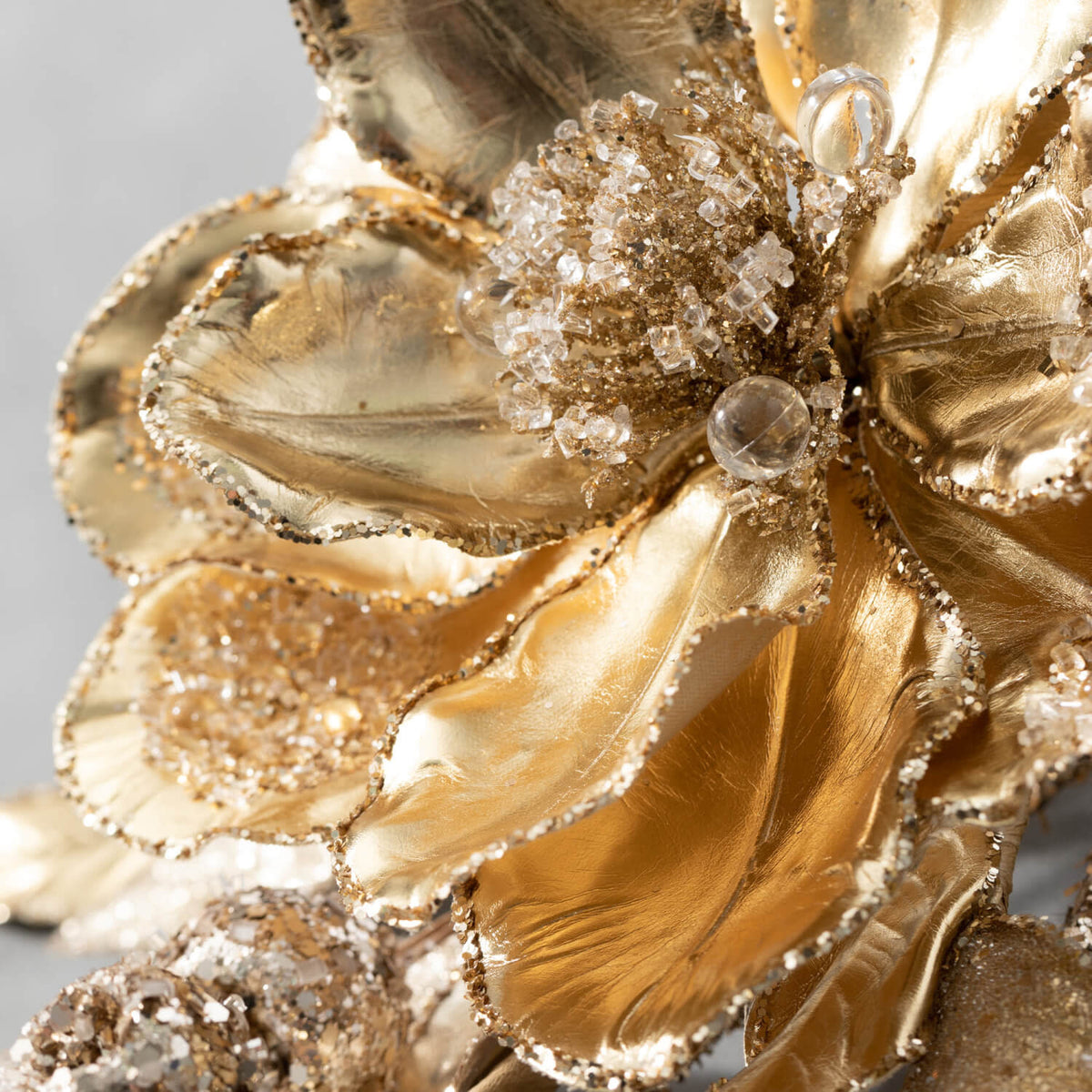 36-inch gold magnolia berry spray with hand-applied glitter beadwork in metallic polyester