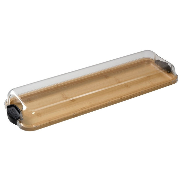 Rectangular bamboo cutting board with black handles and a plastic lid