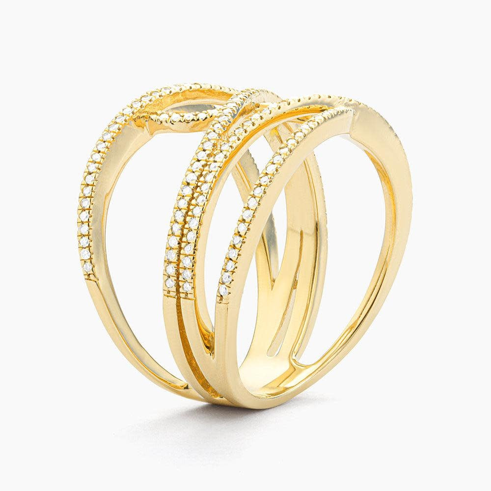 Side view of a silver statement ring with diamonds on the band representing interconnection.
