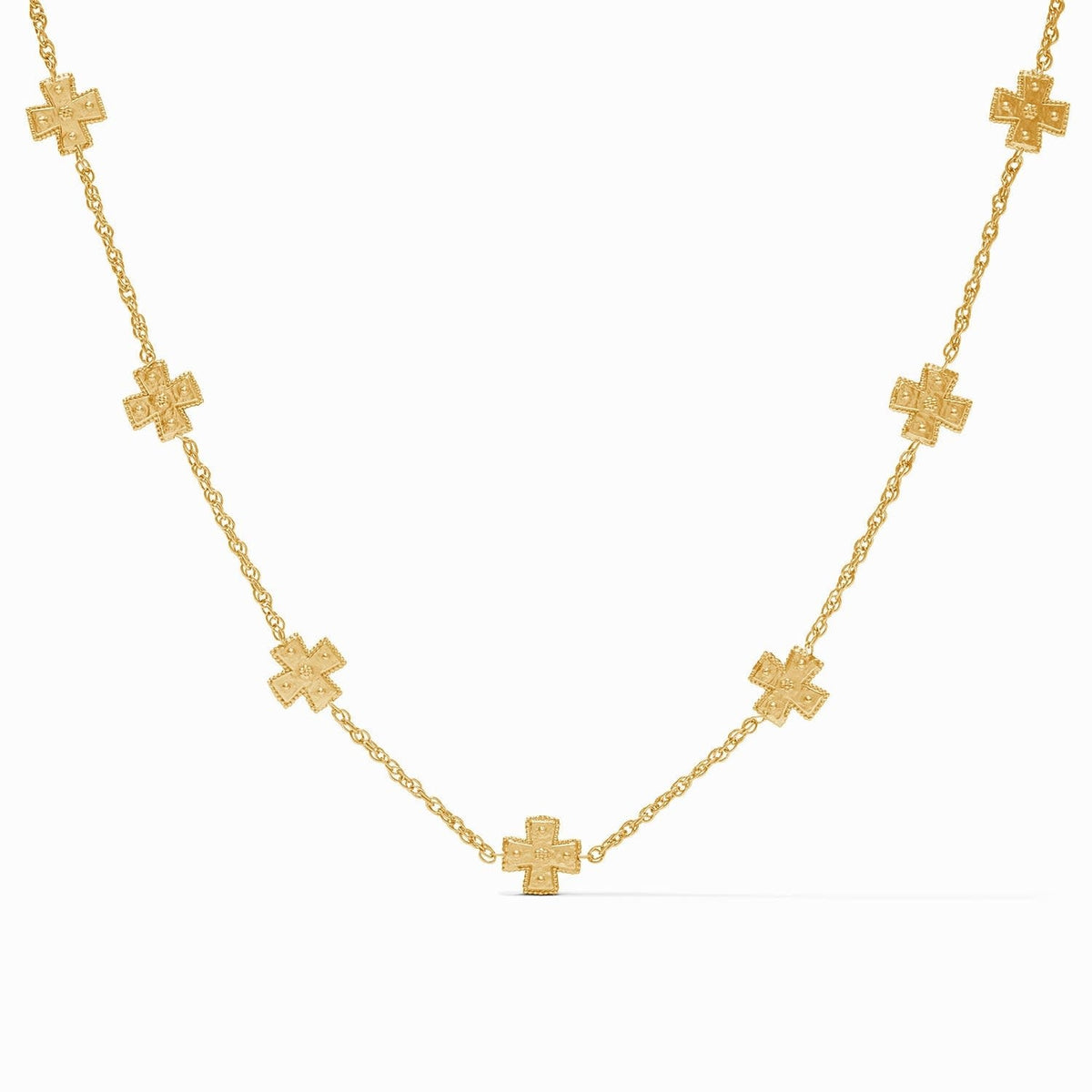 Delicate gold rope chain necklace featuring hand-hammered crosses with golden beads.