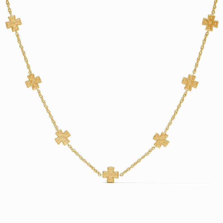 Delicate gold rope chain necklace featuring hand-hammered crosses with golden beads.