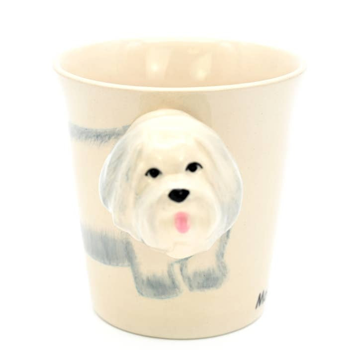 Maltese mug with a white ceramic body featuring a hand-painted Maltese dog silhouette in black.